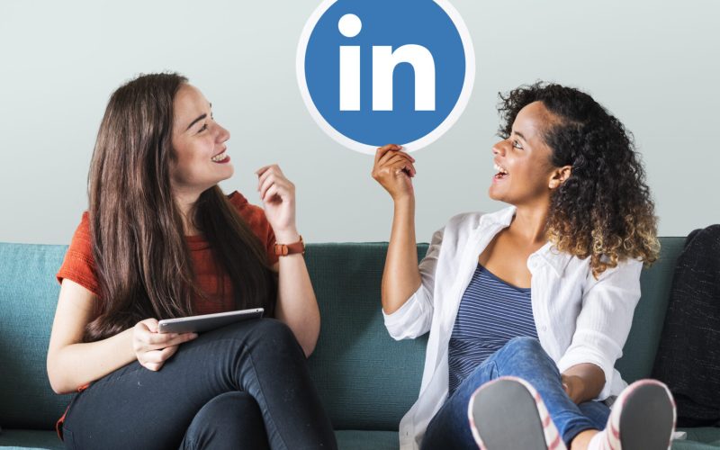 Women holding a Linkedin logo